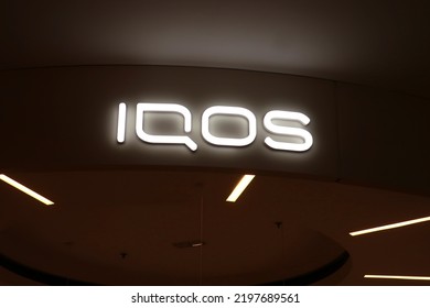 IQOS Signage, Logo At The Heated Tobacco And Electronic Cigarette Store, Blue City Shopping Mall. WARSAW, POLAND - AUGUST 10, 2022