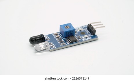 Ir infrared light sensor electronic component module. Small single board computer, device for study at white isolated. Electronics diy robotics chip microcontroller. Infrared obstacle avoidance. - Shutterstock ID 2126571149