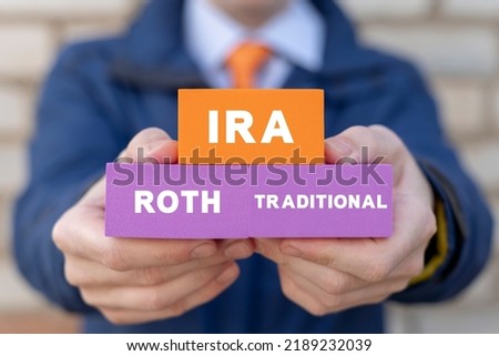 IRA Individual Retirement Account Concept. Choice of Traditional IRA or Roth IRA retirement plans.