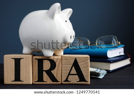 IRA individual retirement account written on wooden cubes.
