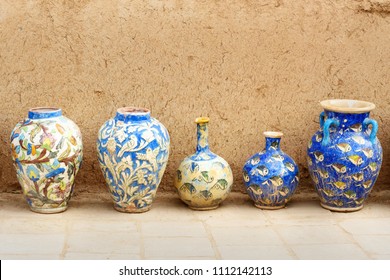 Iranian diferent clay vases near the wall in Yazd. Iran
