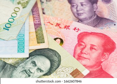 Iranian Rial And China Yuan Renminbi Banknotes. Iran China Rial Yuan 