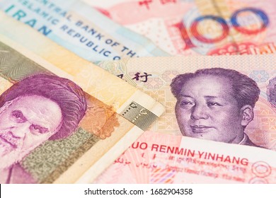 Iranian Rial With China Yuan Renminbi Currency Banknotes. Iran China   