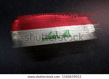 Iraq Flag Made of Metallic Brush Paint on Grunge Dark Wall