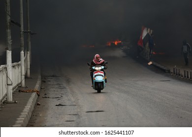 Iraq Najaf 22/1/2020
An Iraqi Citizen Rides His Motorbike After Cutting The Road By Burning Tires To Protest The Iraqi Government