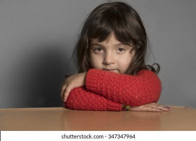 Iraqi Small Girl Leaning On Table 