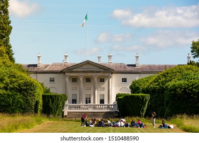 IRELAND, DUBLIN - JULY 03 2019 - Students In Front Of The Official Residence Of The President Of Ireland, Located In Phoenix Park, Dublin, Áras An Uachtaráin