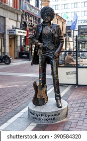 Ireland, Dublin: Street scene with famous Irish musician rock star band leader Phil Lynott statue memorial in the city center of the Irish capital. June 09, 2015