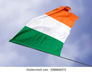 Ireland's flag is isolated on a sky background. flag symbols of Ireland. close up of a Irish flag waving in the wind. - Shutterstock ID 2088868372