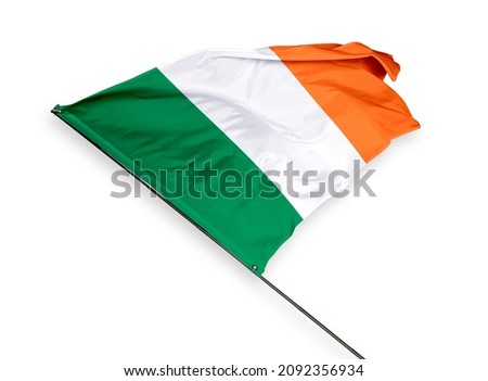 Ireland's flag is isolated on a white background. flag symbols of Ireland. close up of a Irish flag waving in the wind.