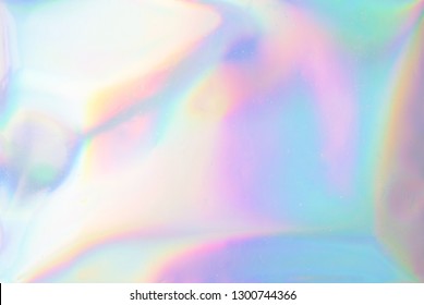Unglaublicher Hintergrund. Holografische abstrakte weiche Pastellfarben Hintergrund. Holografische Folie, Hintergrund. Trendy kreativer Farbverlauf.