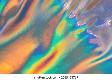 Iridescent holographic abstract crazy texture. Hologram swirly and wavy background in pastel colors
