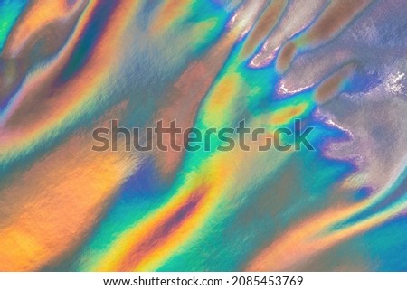 Iridescent holographic abstract crazy texture. Hologram swirly and wavy background in pastel colors