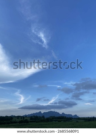 Iridescent pileus clouds dance as the sky​ on​ top​ the​ rice​ field​
