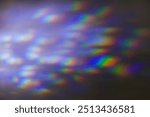 Iridescent rainbow blue prism light flare on black background