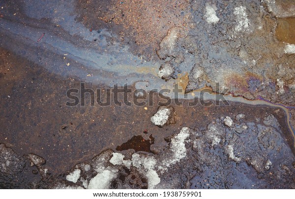 iridescent spot of gasoline on pavement as
Texture or
Background