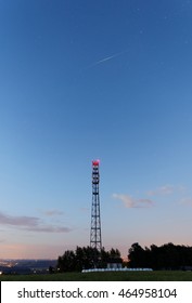 Iridium Satellite Flare Above A Mobile Phone Pylon. 