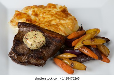 Irish Beef Steak With Cheesy Mashed Potatoes And Roasted Vegetables.