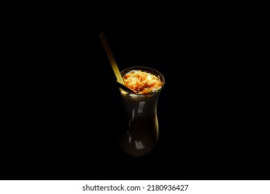 Irish Coffee In Glass On Black Background.