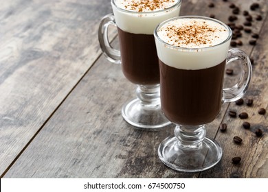 Irish Coffee In Glass On Wooden Table
