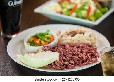 Irish Corned Beef And Cabbage With A Side Of Mashed Potatoes And Vegetables. Beer Accent, Shot In A Shallow Depth Of Field.