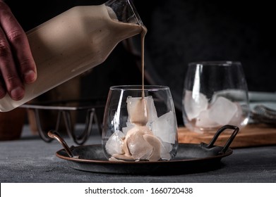 Irish Cream Coffee Liqueur With Ice On Dark Background