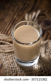 Irish Cream Liqueur (detailed Close-up Shot) On Wooden Background