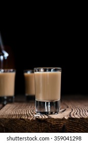 Irish Cream Liqueur (detailed Close-up Shot) On Wooden Background