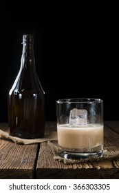 Irish Cream Liqueur (detailed Close-up Shot) On Wooden Background