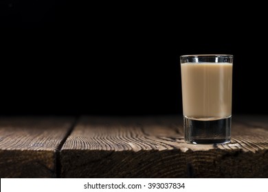 Irish Cream Liqueur (detailed Close-up Shot) On Wooden Background