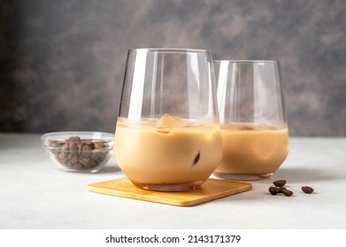 Irish Cream Liqueur In A Glass With Ice Cubes And Coffee Bean