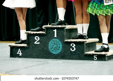 Irish Dance Champions on a Winners Trophy Block at a Feis Competition
