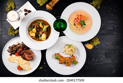 Irish Dinner. Beef Meat Stewed With Potatoes, Carrots On Wooden Background. Homemade Winter Comfort Food Table Set Irish Holiday Patrick's Day. Festive Table Setting For St.Patrick's