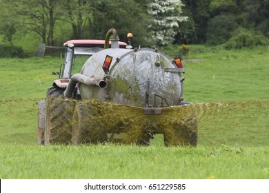 Irish Farmer Spreading Slurry In Field