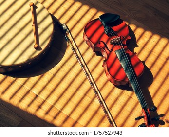 Irish Bodhrán And Fiddle On Wooden Floor