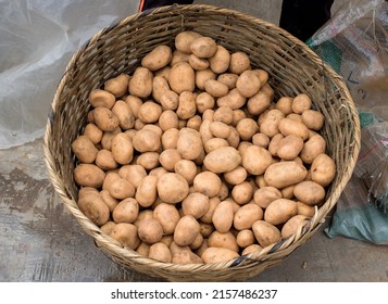 Irish Potatoes Fill Up A Basket In A Lagos Market.