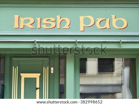Irish pub, frontal view to the old facade of an antique pub.