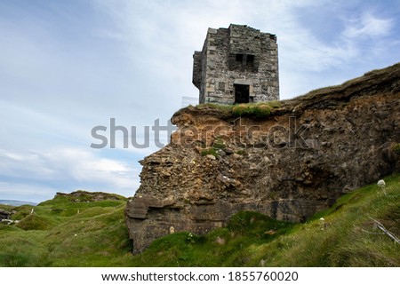 Irish Signal tower ruin at the edge of the cliffs of Moher, county Clare Ireland 