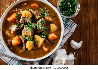 Irish stew made with beef, potatoes, carrots and herbs. Traditional  St patrick's day dish. Top view