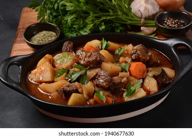 Irish stew made with beef, potatoes, carrots and herbs. Traditional St.Patrick's day dish, stewed in dark Guinness beer - Powered by Shutterstock