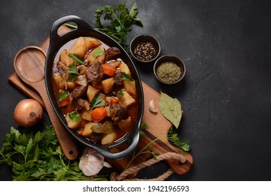 Irish stew made with beef, potatoes, carrots and herbs. Traditional St.Patrick's day dish, stewed in dark Guinness beer - Shutterstock ID 1942196593