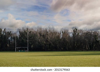 Irish Tall Goal Posts On A Training Pitch. Camogie, Hurling, Gaelic Football And Rugby Exercise Ground And Park. Cloudy Sky, Nobody. Outdoor National Sport Concept