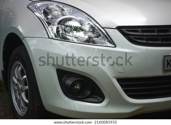 Iritty, Kerala, India -\
05-07-2022. Maruthi Swift Dzire Car Clear lens head light with fog\
lamp and grille