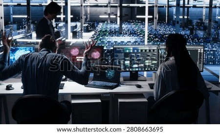 Irked computing facility software programmer smashing desk, upset by faulty equipment.