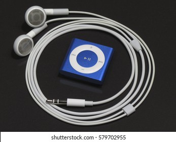 IRKUTSK, RUSSIA - JANUARY 31, 2017: New Audio Player IPod Shuffle 4th Generation And Standard Headphones Unpacked In The First Day After Buying. Produced By Apple Inc.