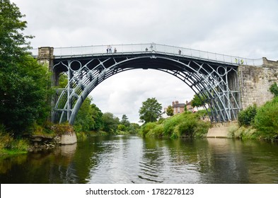 The Iron Bridge at Ironbridge, spanning the River Severn, viewed from low level along the river - Powered by Shutterstock