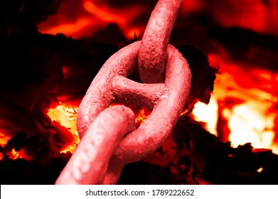 Iron chain links heated by a furnace fire. Blacksmithing craft. Limit state. Hot metal. Whipping up relationships. Background image. Magazine cover. Template with place for text. Poster. Metallurgy. - Powered by Shutterstock