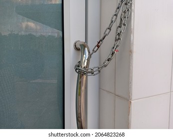 Iron Chain On The Door.  The Bathroom Door Handle Has A Steel Chain To Lock.