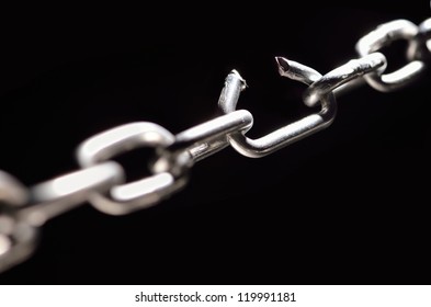 Iron Chain with one link about to break