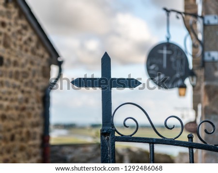 Iron cross of a gate in Le Mont Saint Michelle (Normandy, France)